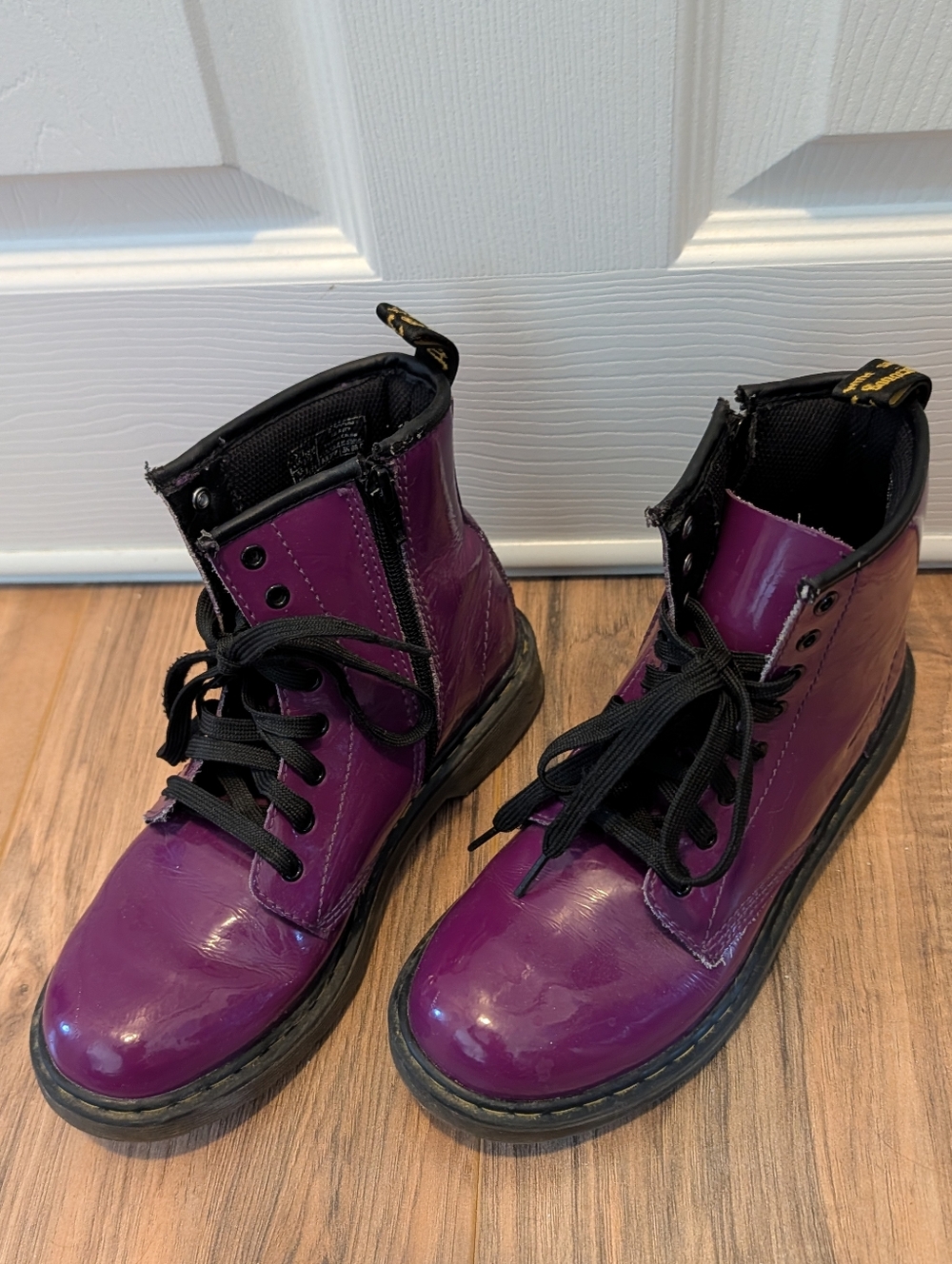 Dr. Martens Delaney boots in purple patent leather